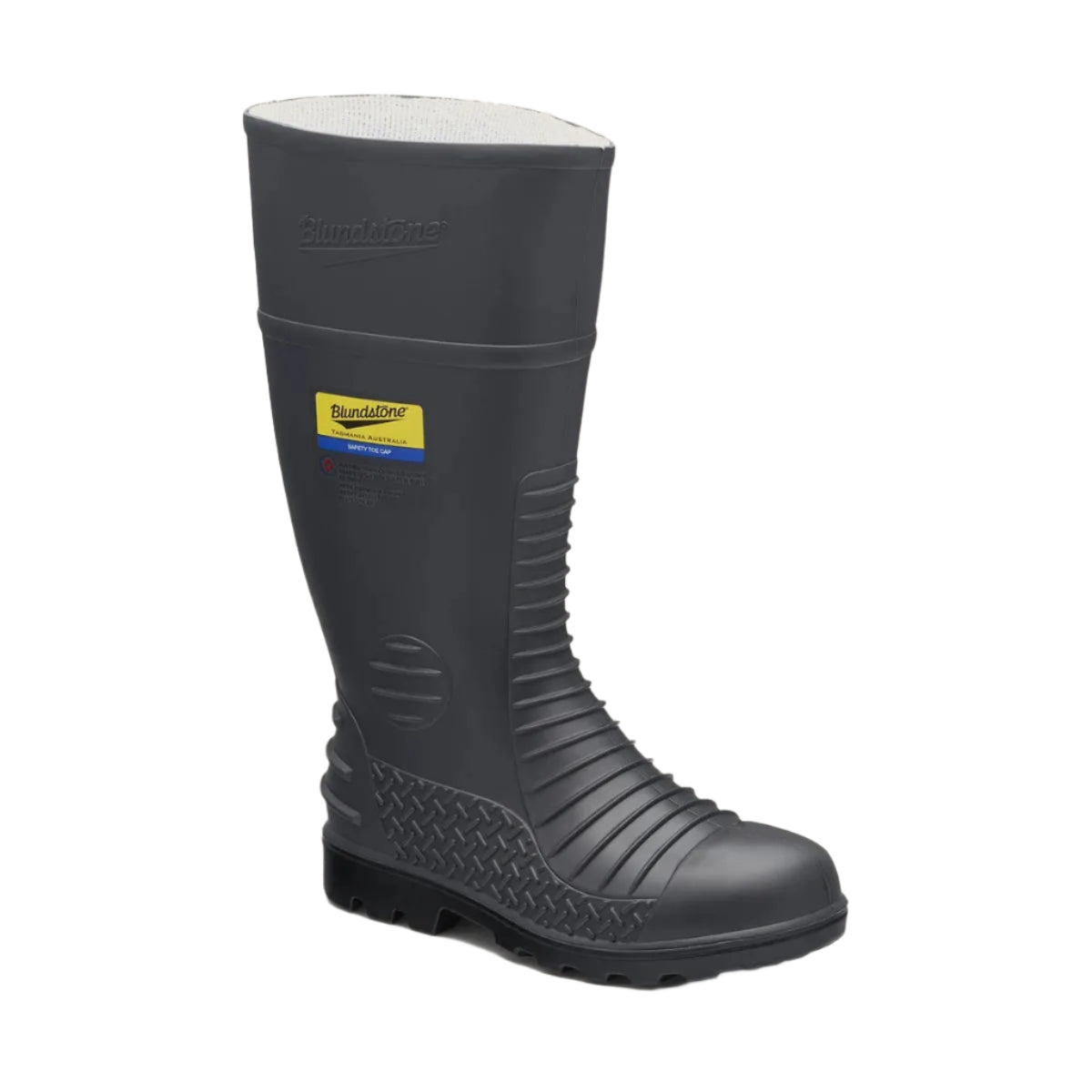 Black rubber boot with a brand label on a beige background