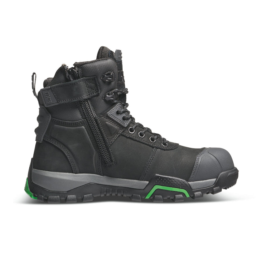 Black hiking boot with green accents on a white background