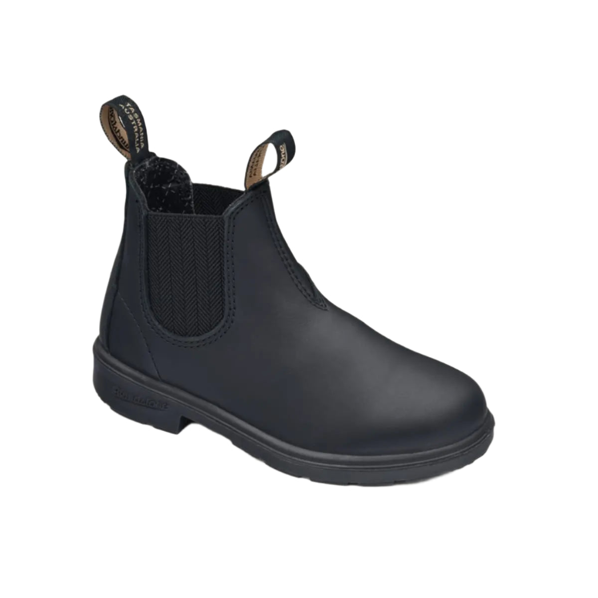 Black Chelsea boot on a beige background