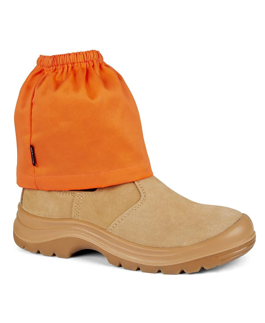 Orange gaiter over a tan boot on a white background