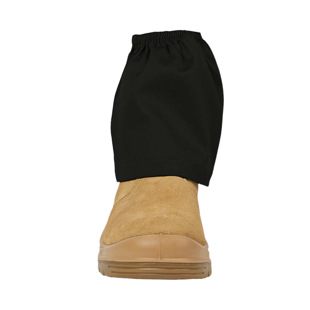 Black boot gaiter over a tan boot on a textured gray background